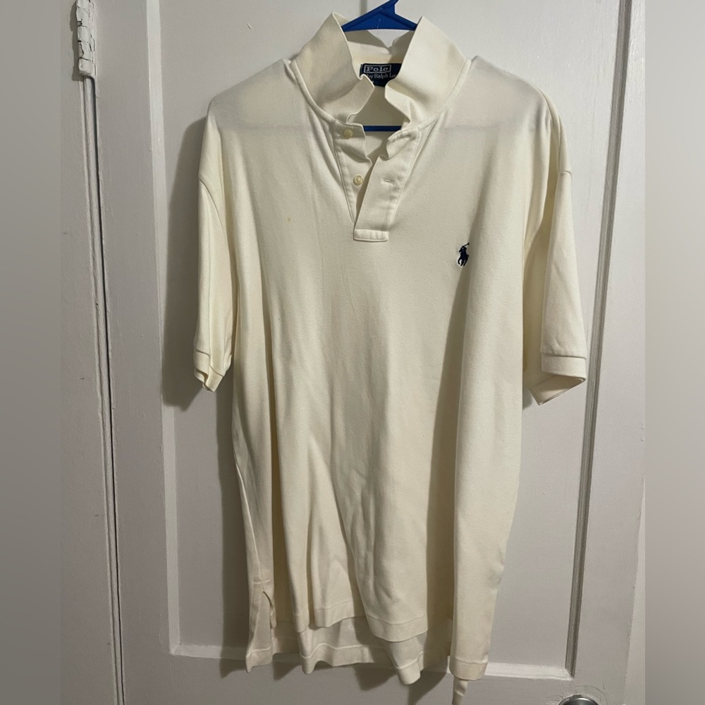 Polo size large no damages. Color is crème.
